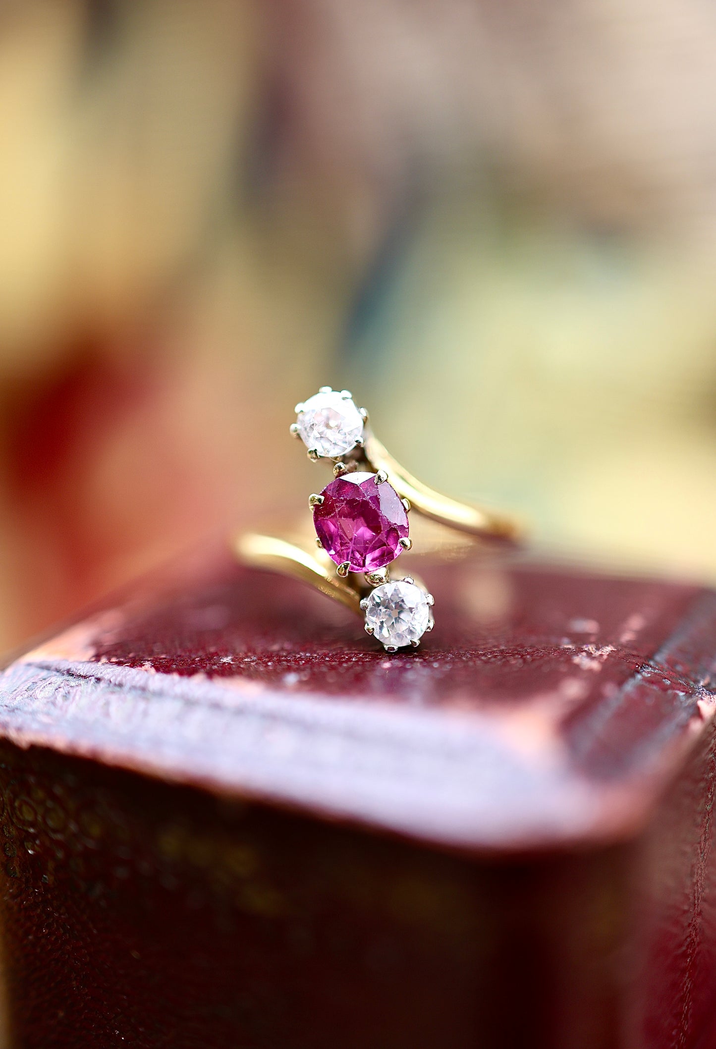 A very fine Natural and Untreated, 1.20 Carat Ruby & Diamond, Three Stone Crossover Ring, in 18 Carat Yellow Gold (stamped). Circa 1930