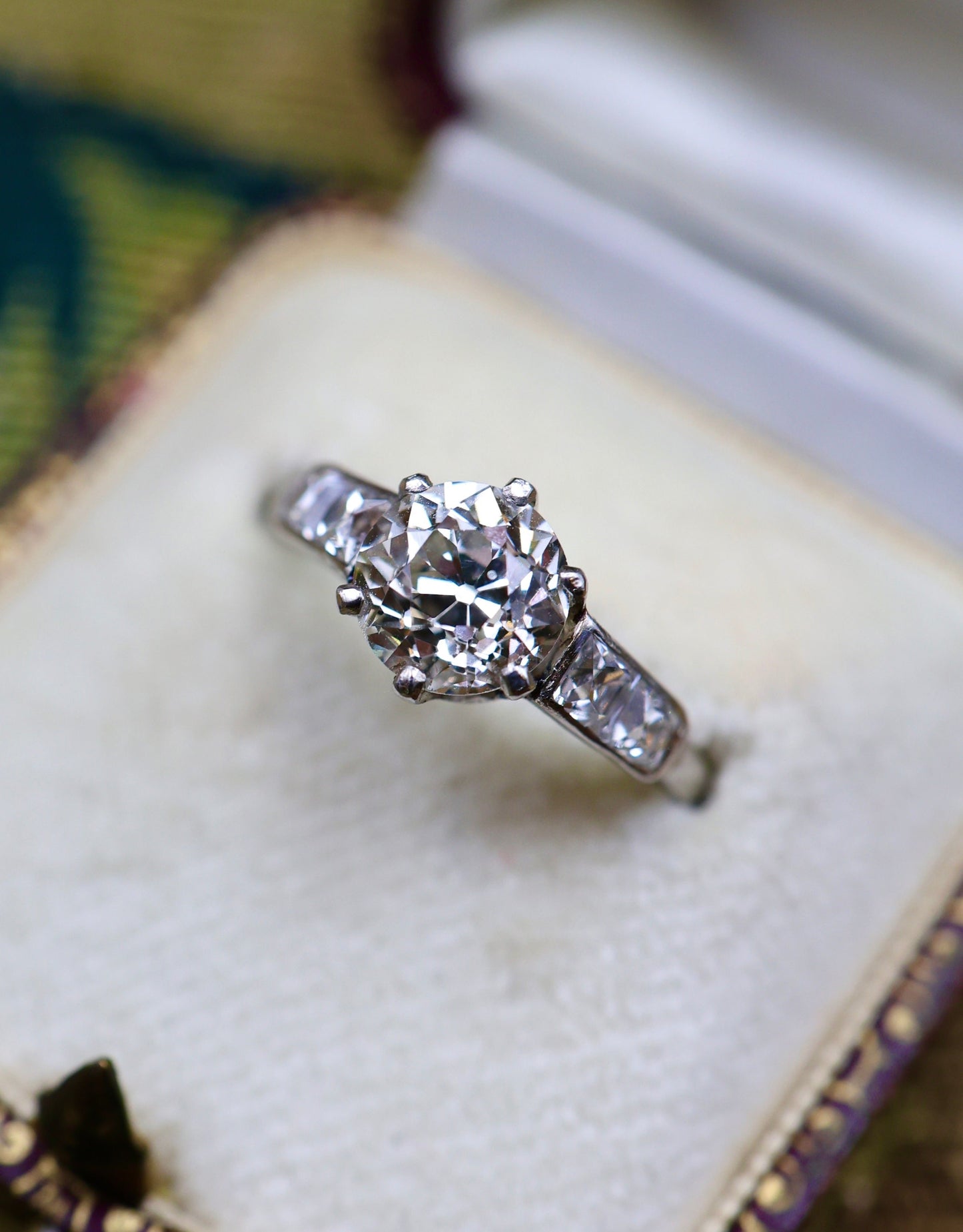 A very fine 1.60 Carat Old Cut Diamond & Platinum Solitaire Engagement Ring with French Cut Diamond Shoulders, English, Circa 1930