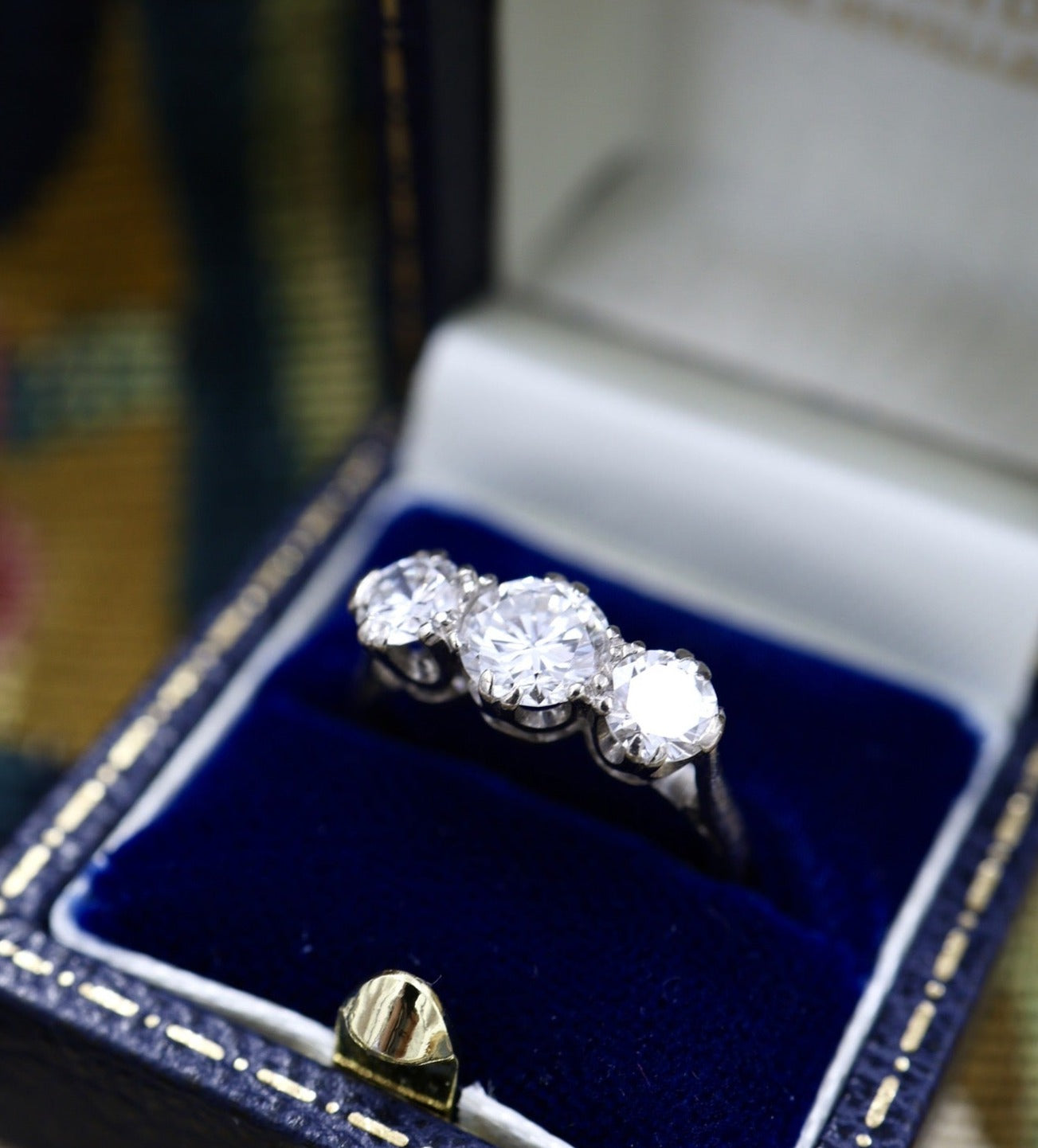 An exceptional 18ct White Gold (hallmarked), 1.55 Carat Three Stone Diamond Engagement Ring by Cropp & Farr Ltd.  Circa 1971