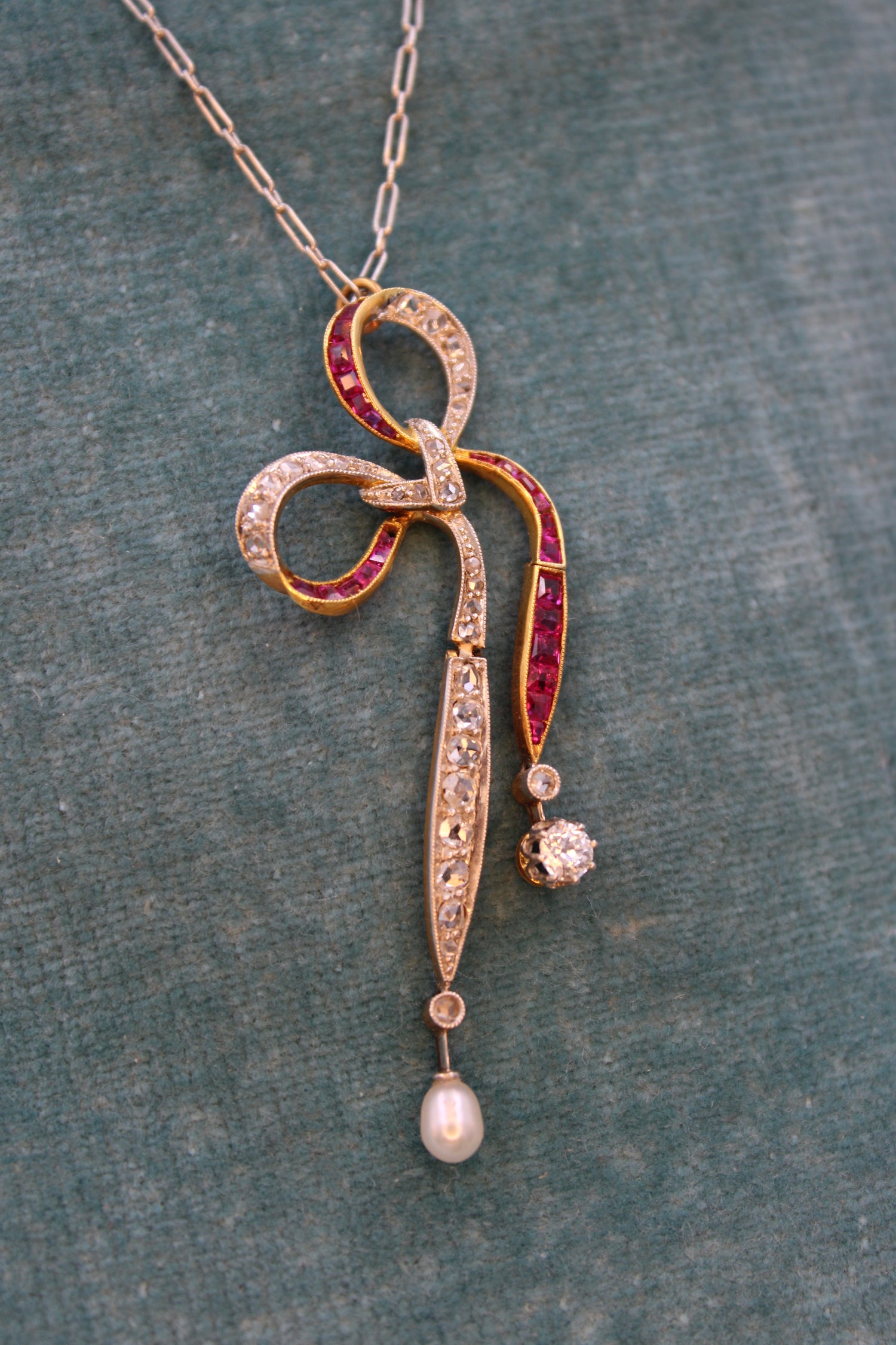 A Diamond, Ruby & Pearl Bow Pendant set in 18ct Yellow Gold and Platinum, Circa 1915 - Robin Haydock Antiques