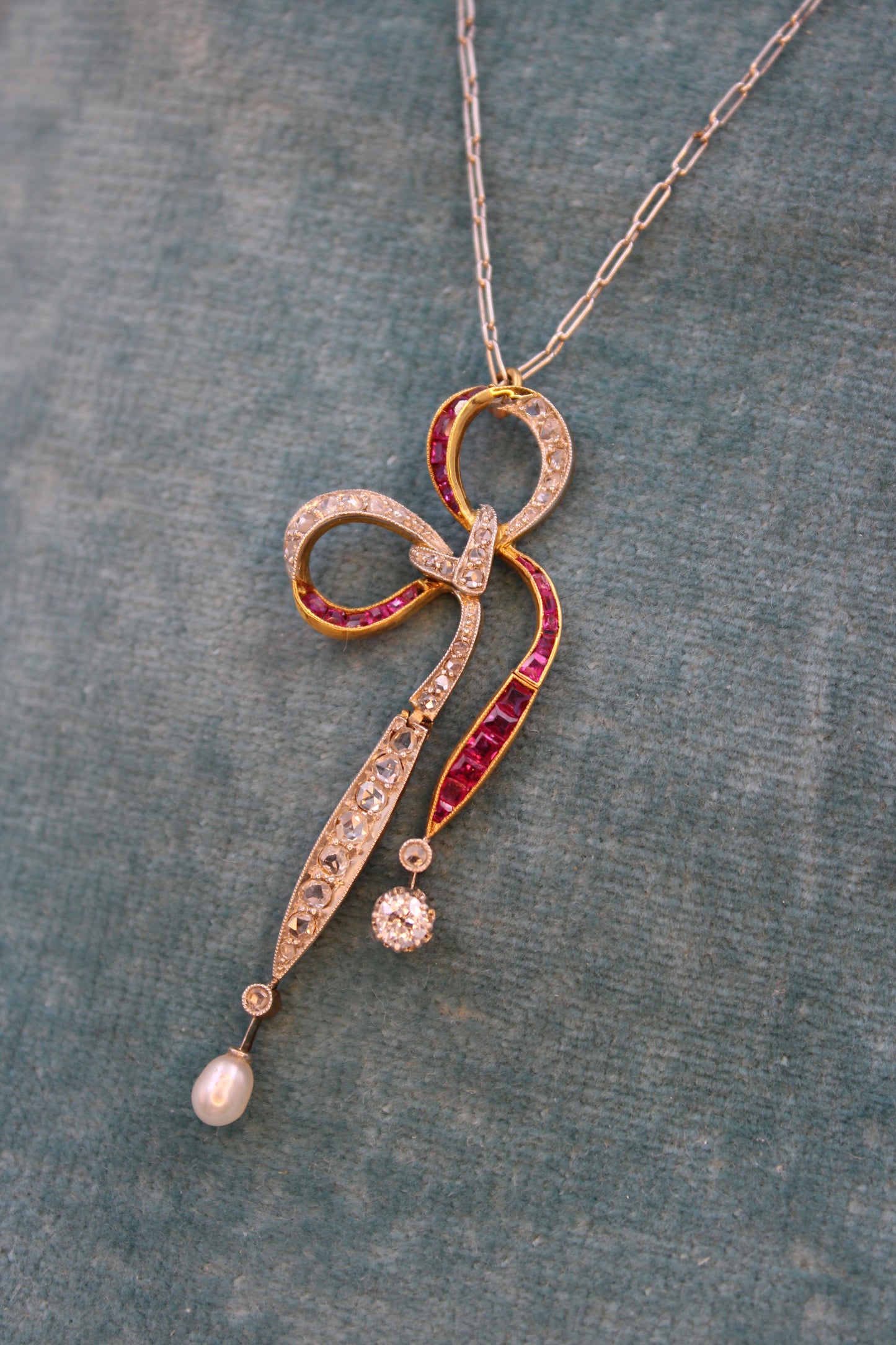 A Diamond, Ruby & Pearl Bow Pendant set in 18ct Yellow Gold and Platinum, Circa 1915 - Robin Haydock Antiques