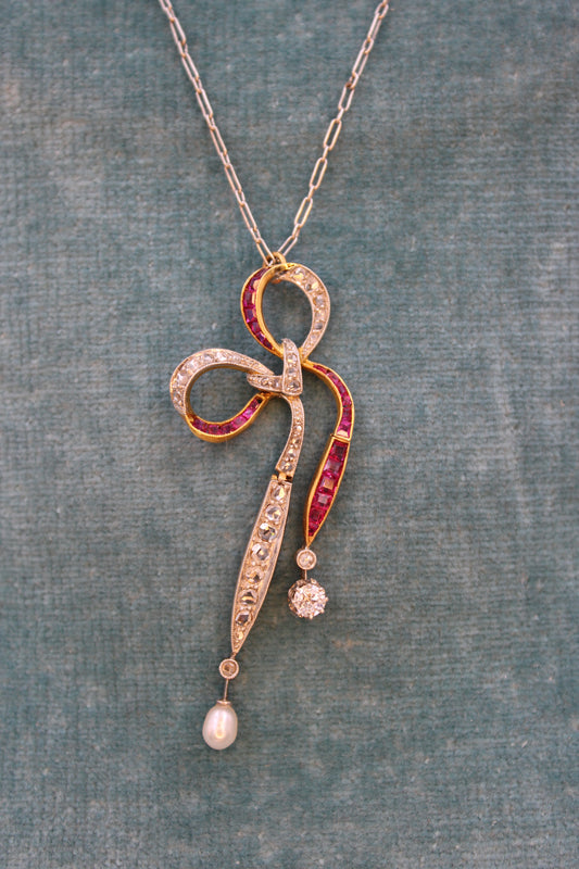 A Diamond, Ruby & Pearl Bow Pendant set in 18ct Yellow Gold and Platinum, Circa 1915 - Robin Haydock Antiques