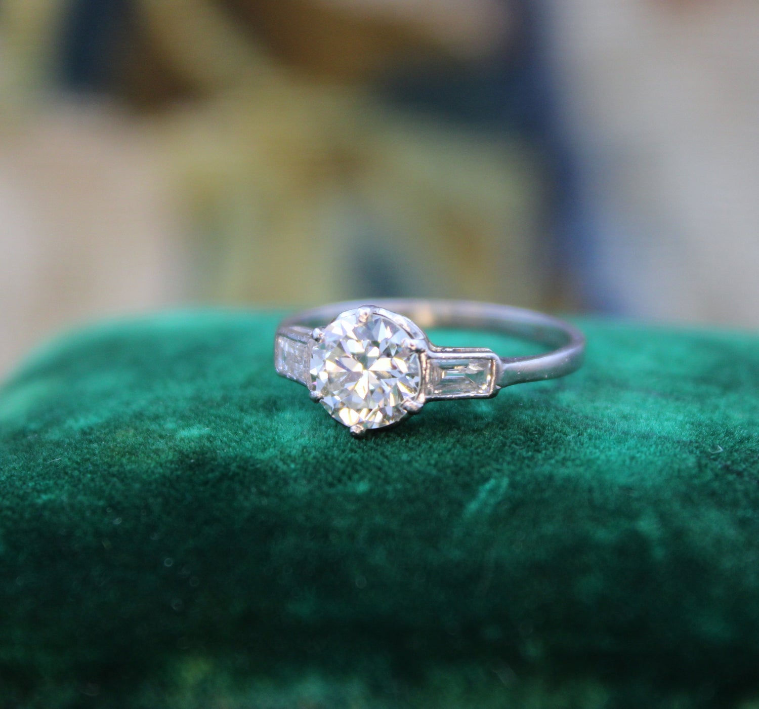 A Beautiful 1.04 Carat, Art Deco, Diamond Solitaire Engagement Ring, with Baguette-cut Diamond  Shoulders, set in Platinum.  Circa 1930 - Robin Haydock Antiques