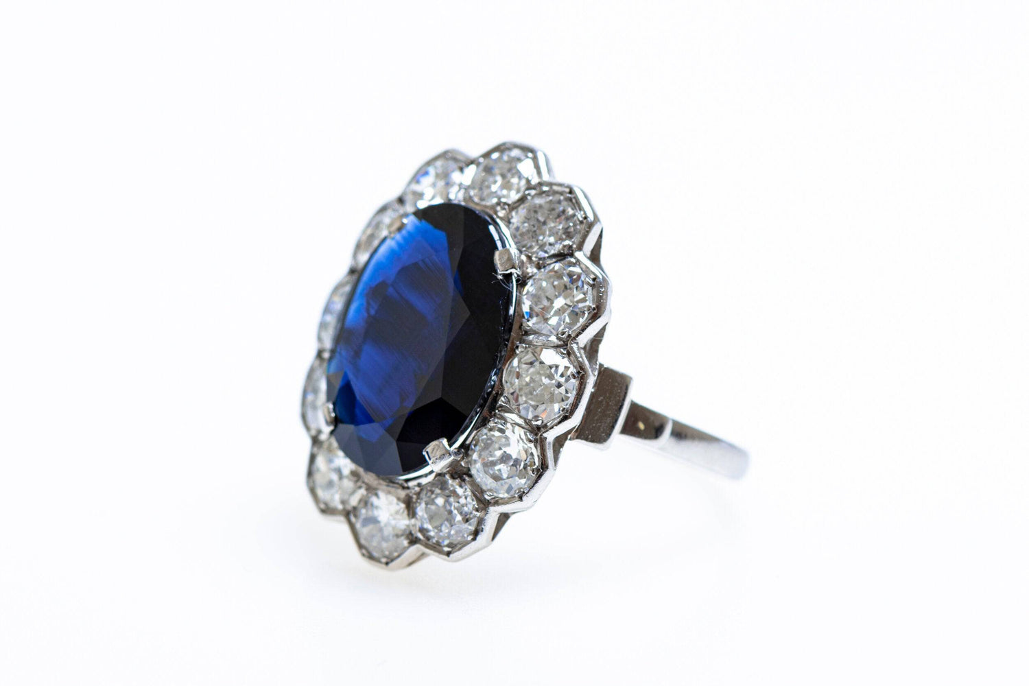 A remarkable Oval Sapphire & Diamond Cluster Ring mounted in Platinum, French, Circa 1935 - Robin Haydock Antiques