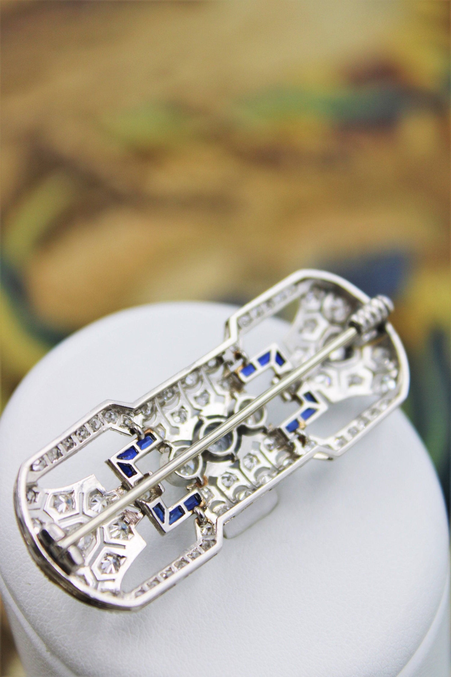 A very fine Platinum, Diamond and "Calibre cut" Sapphire "Art Deco" Brooch, Circa 1930. - Robin Haydock Antiques
