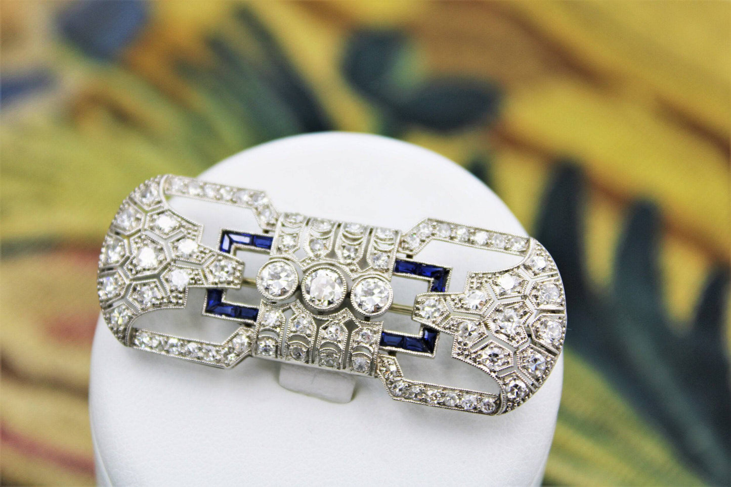 A very fine Platinum, Diamond and "Calibre cut" Sapphire "Art Deco" Brooch, Circa 1930. - Robin Haydock Antiques