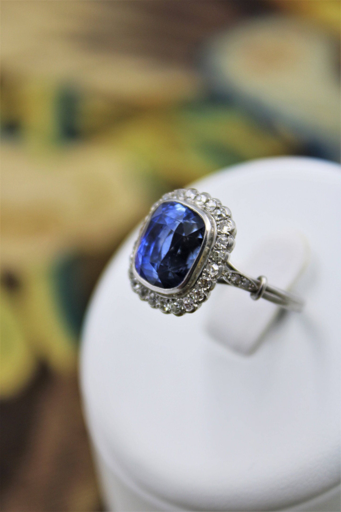 An exquisite 8.10ct Natural Untreated Ceylon Sapphire and Diamond Cluster Ring mounted in Platinum, English, Circa 1925 - Robin Haydock Antiques
