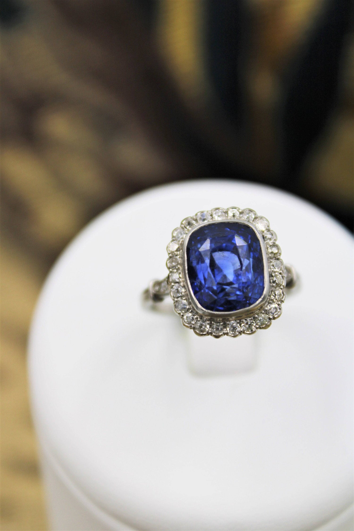 An exquisite 8.10ct Natural Untreated Ceylon Sapphire and Diamond Cluster Ring mounted in Platinum, English, Circa 1925 - Robin Haydock Antiques