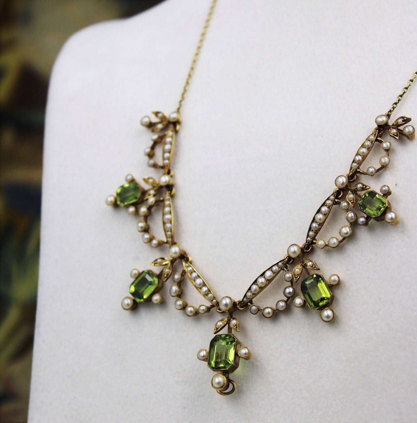 An exquisite Peridot & Seed Pearl Festoon Necklace with a matching Quatrefoil style detachable Pendant/Brooch in 15 Carat Yellow Gold, English, Circa 1900 - Robin Haydock Antiques