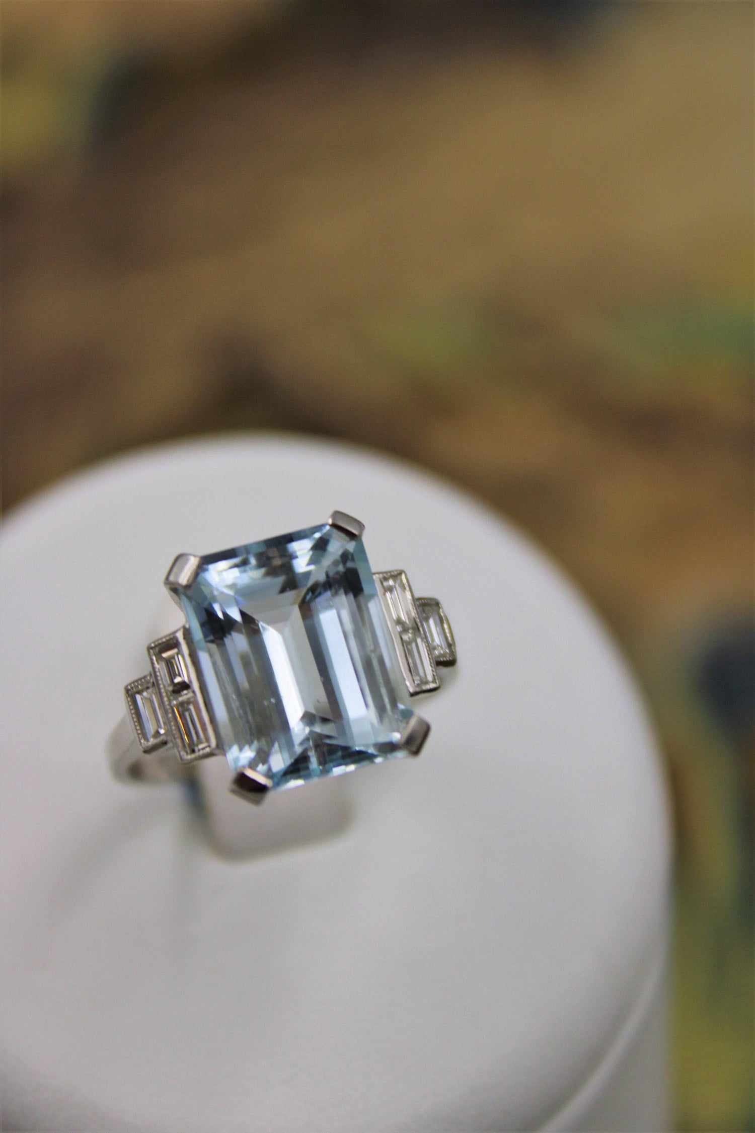 A very beautiful Platinum (marked) Aquamarine of approximately 8 Carats and Diamond stepped shouldered Ring, Mid 20th Century. - Robin Haydock Antiques